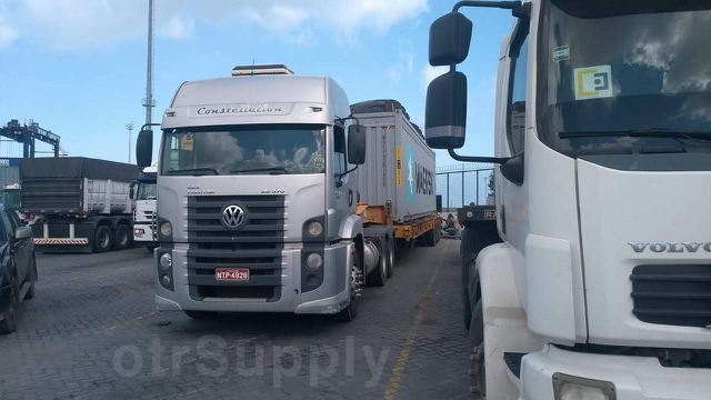 otrSupply - truck transporting a container loaded with goodyear 52/80-57 hrl l4 wheel loader tires